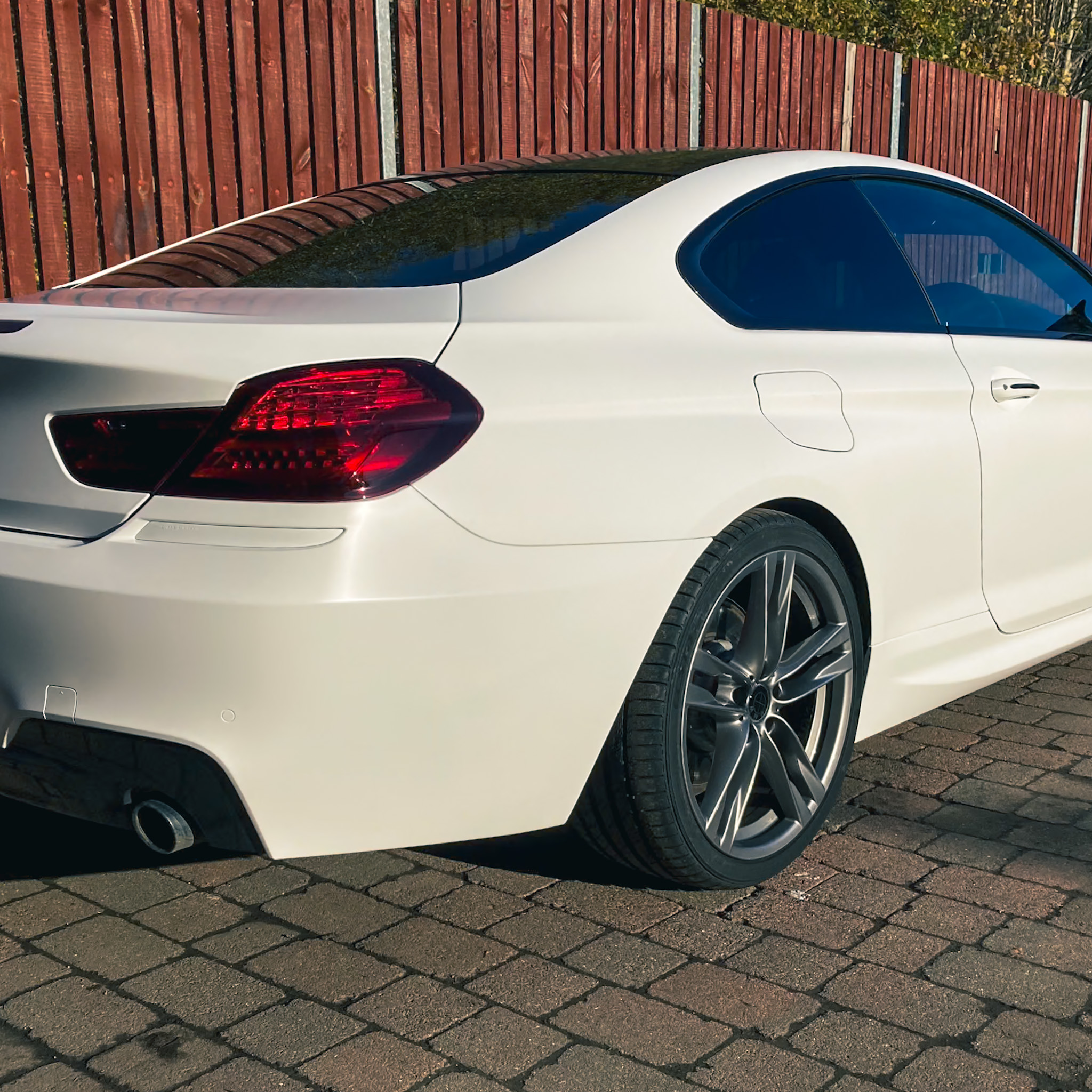 A car receiving professional window tinting service to enhance privacy and protect the interior.